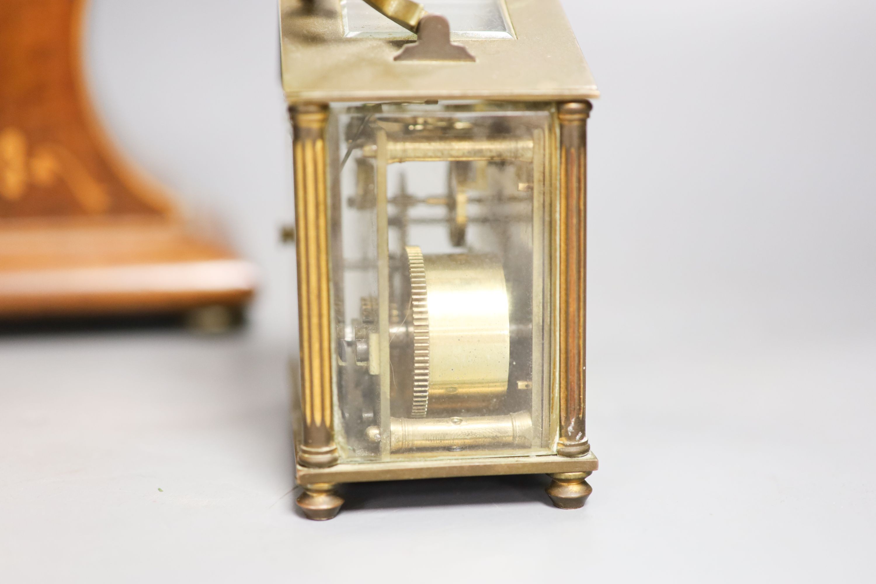 A Edwardian inlaid mahogany mantel timepiece and a brass carriage timepiece